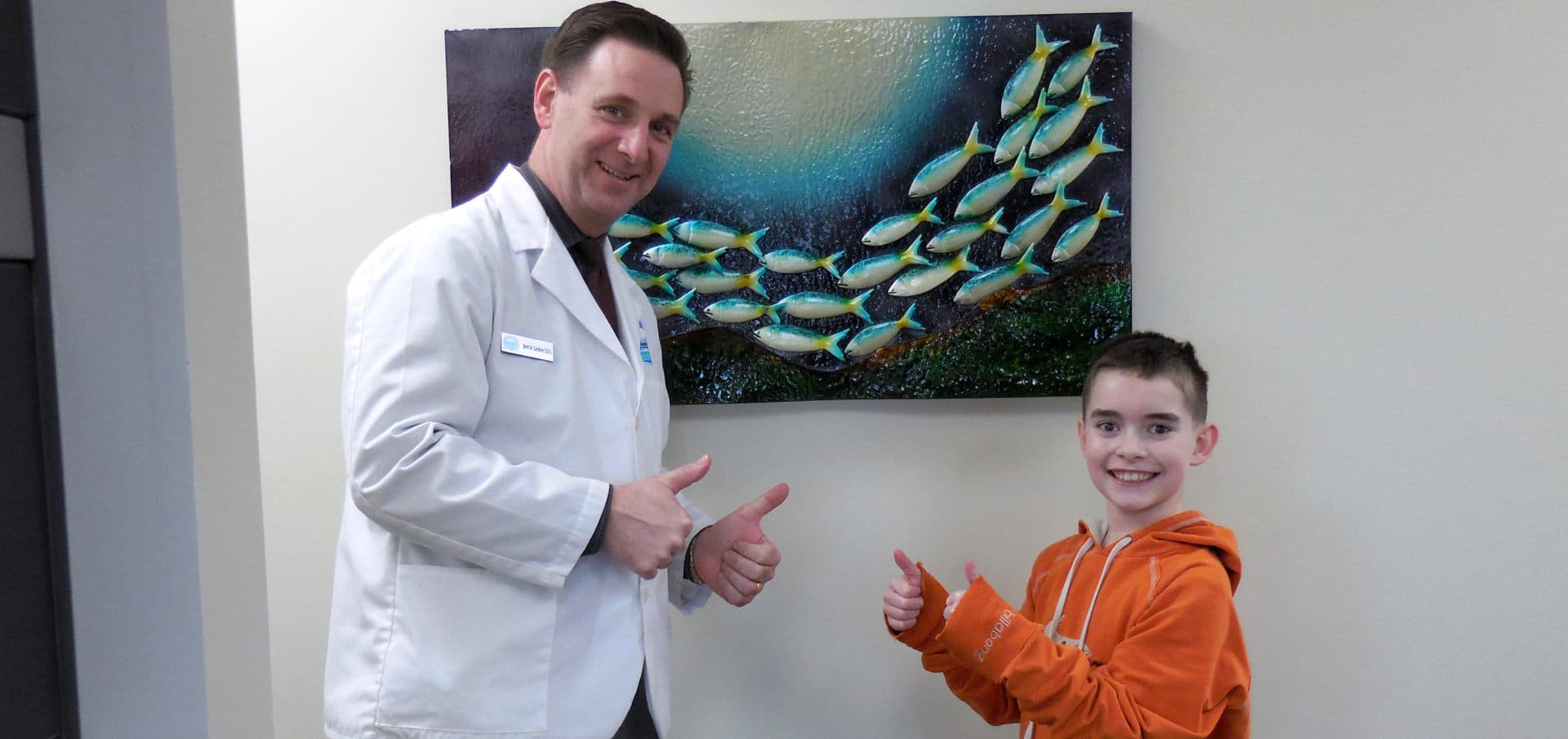 Anchorage dentists: photo of young patient and dentist